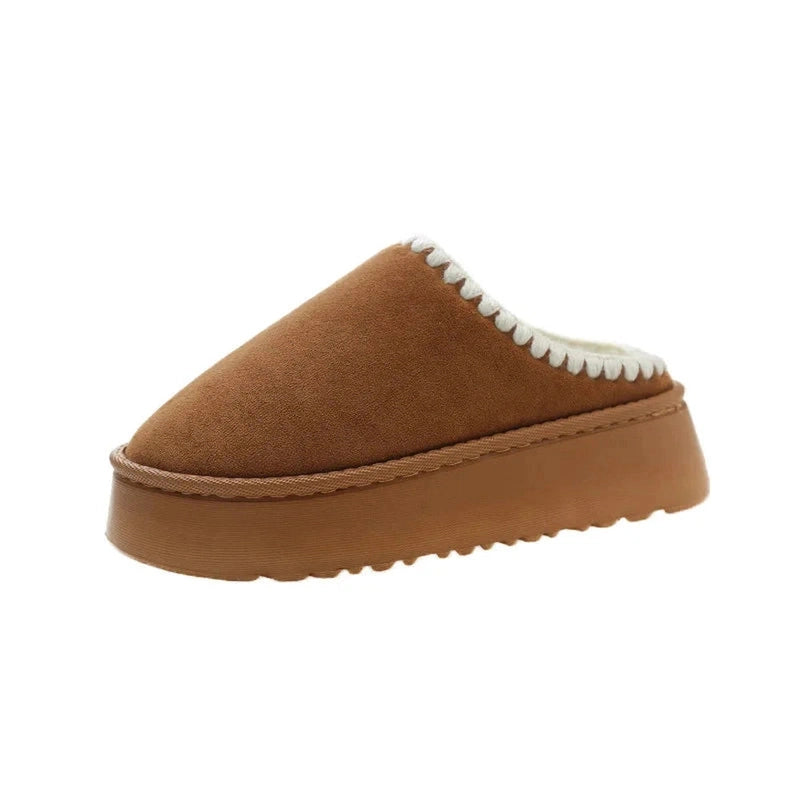 A brown platform slipper in a clean slip-on design, free of any fur detailing.