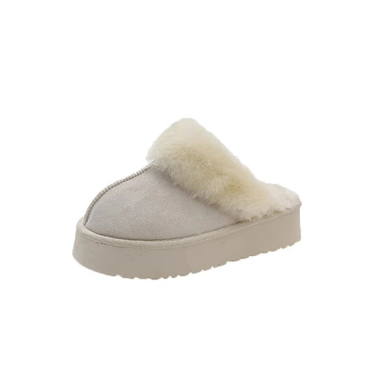 A gray slip-on platform slipper with a thick faux fur collar completely surrounding the foot opening.