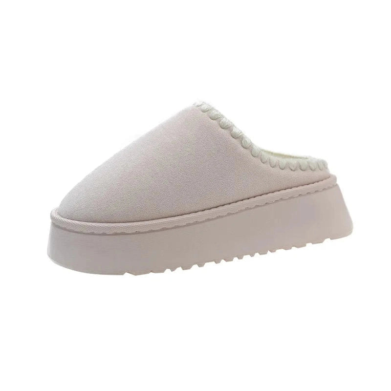 A gray slip-on platform slipper with a clean, minimal collar and no fur detailing