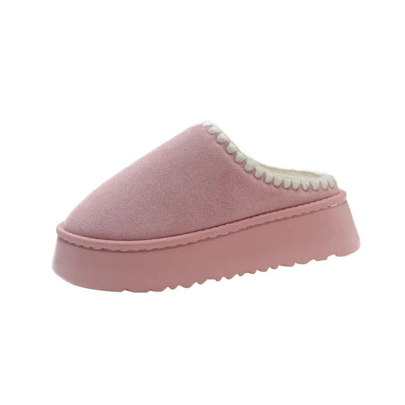 A warm dusty pink platform slipper shown from the side, with a clean and fur-free slip-on design.