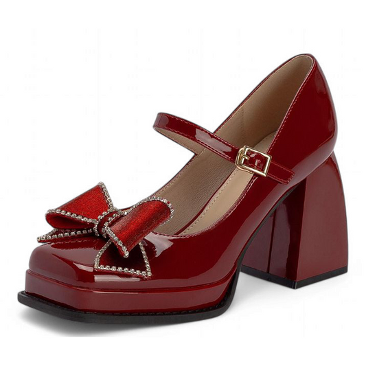 Single shoe in three-quarter front angle, velvet bow with sparkling bead trim atop square toe.