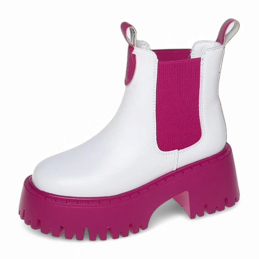 A clean side view of the white Sara Chelsea boot with vivid pink sole and matching pink elastic panel.