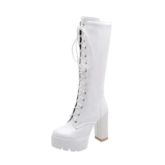 A white Victorian-inspired knee-high boot with lace-up front and thick block heel, shown alone against a clear background.