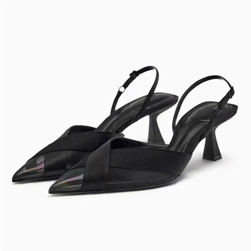 Black cross-strap satin slingback with kitten heel, white backdrop