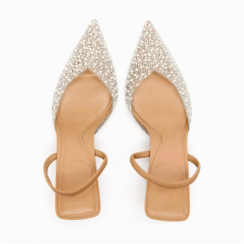Top view of pearl pair showing pointed toes and beaded pattern