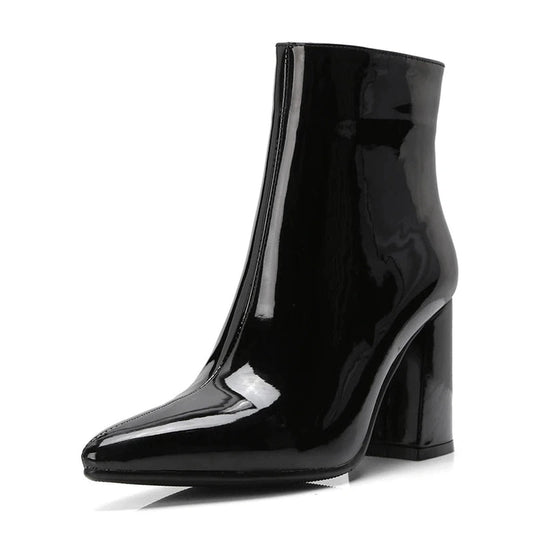 Front-angled view of black patent boot, high shine finish.
