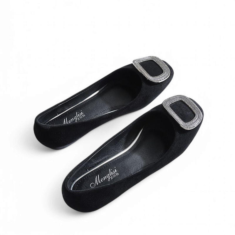 Two black flats side-by-side, showing velvet-like surface and flat heel.