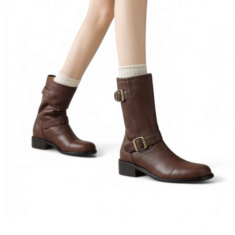 Boots styled on a woman’s feet, showing how they fit around the calf and complement everyday outfits.