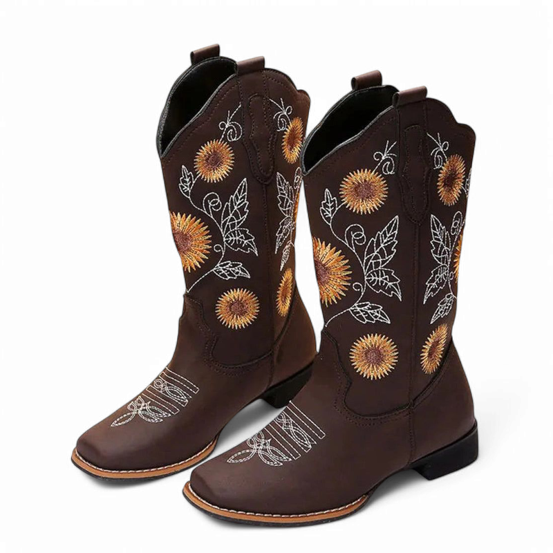 Brown mid-calf cowboy-boot pair with sunflower embroidery, square toe and low heel on white background.
