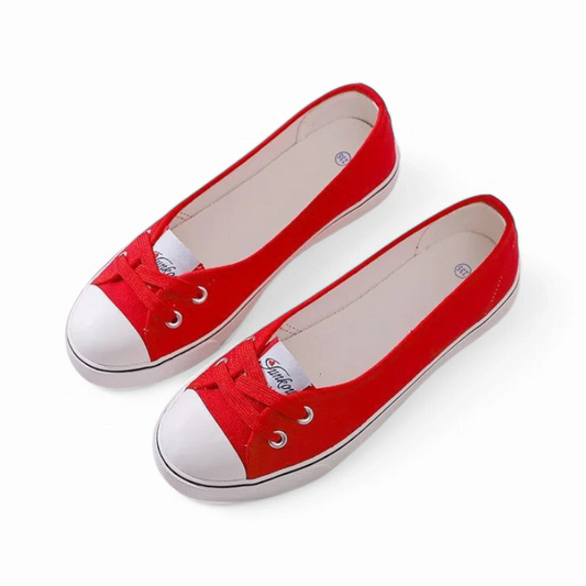 Bright-red pair highlighting white outsole and canvas sidewall strip.