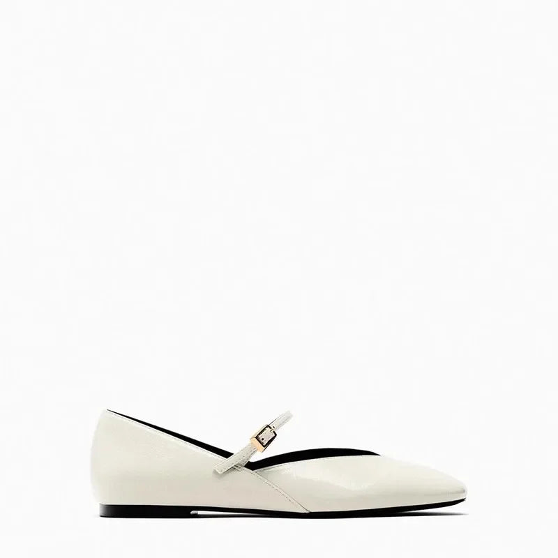 Side view of Merendy Dallas Mary Jane ballet flat in beige with glossy leather and round toe design