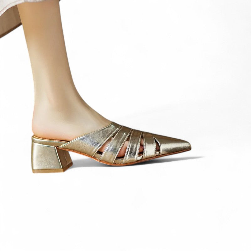 Woman wearing the Merendy Sortara gold metallic mules – front view of one feet