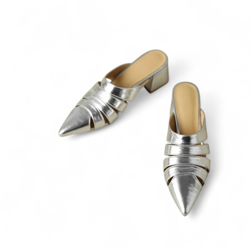 Front view of both Merendy Sortara silver metallic mules