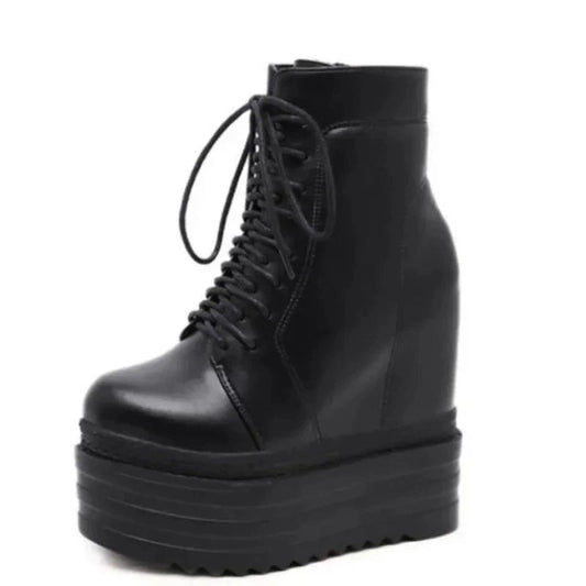 Side view of Merendy Yasmin black lace-up wedge ankle boot with round toe and high platform.