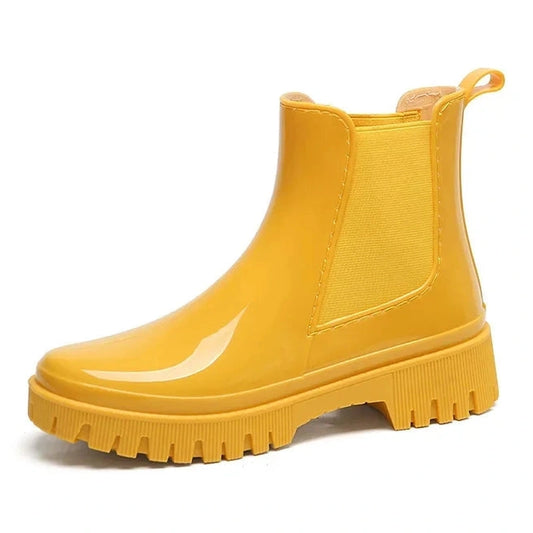 Glossy yellow Chelsea boot – side view.