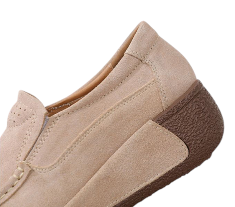 Side profile highlighting suede upper and wedge heel.