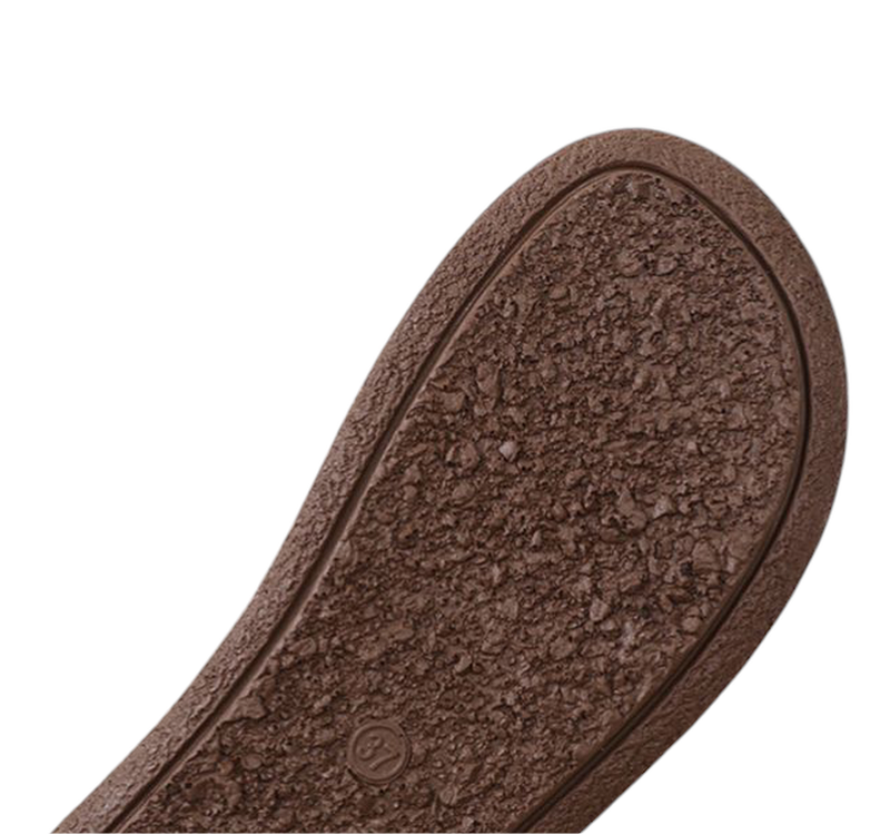 Close‑up of textured brown rubber outsole.